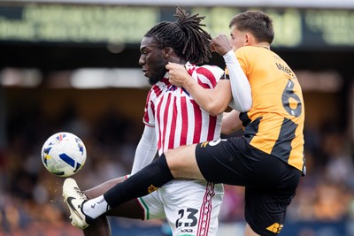 300825 - Cambridge United v Newport County - Sky Bet League 2 - Newport County’s Michael Reindorf and Cambridge United’s Kell Watts 