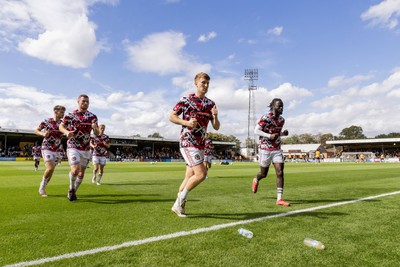 300825 - Cambridge United v Newport County - Sky Bet League 2 - Newport County players warm up against  Cambridge United 