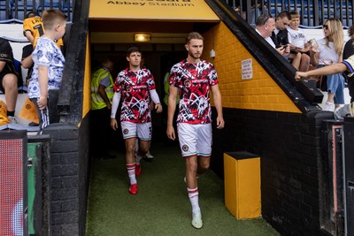 300825 - Cambridge United v Newport County - Sky Bet League 2 - Newport County’s Mathew Smith and Newport County’s Anthony Driscoll-Glennon