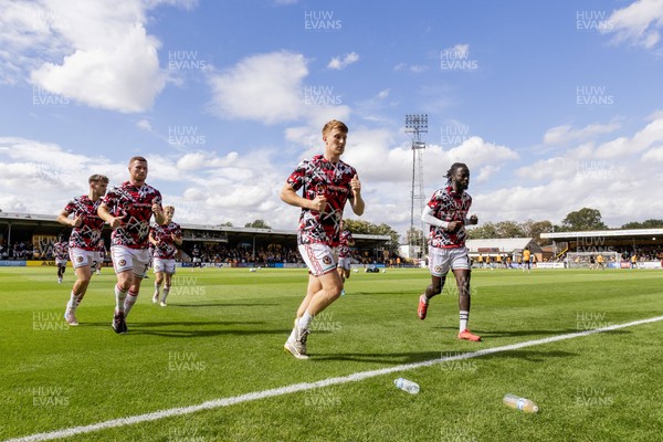 300825 - Cambridge United v Newport County - Sky Bet League 2 - Newport County players warm up against  Cambridge United 