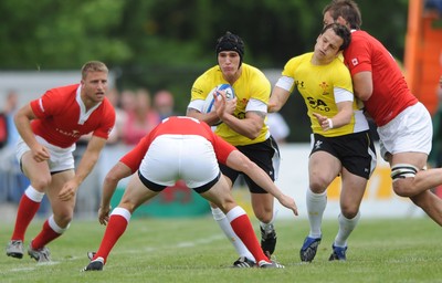 30.05.09 - Canada v Wales - Wales' Tom James is tackled by Canada's Mike Burak. 