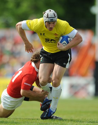 30.05.09 - Canada v Wales - Wales' Jonathan Davies is tackled by Canada's David Spicer. 