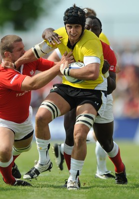 30.05.09 - Canada v Wales - Wales' Robin Sowden-Taylor is held by the Canadian defence. 