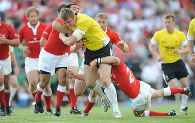 30.05.09 - Canada v Wales - Wales' Dafydd Jones is held by the Canadian defence. 