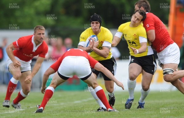 30.05.09 - Canada v Wales - Wales' Tom James is tackled by Canada's Mike Burak. 