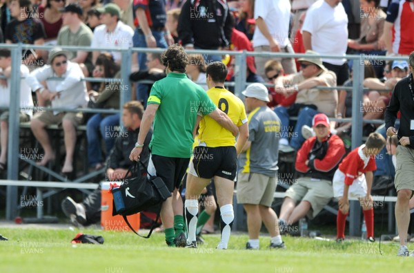 30.05.09 - Canada v Wales - Wales' Gareth Cooper is helped from the field at half time. 