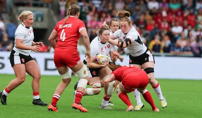 300825 - Canada v Wales, Women’s Rugby World Cup - Gwen Crabb of Wales and Abbie Fleming of Wales charge forward