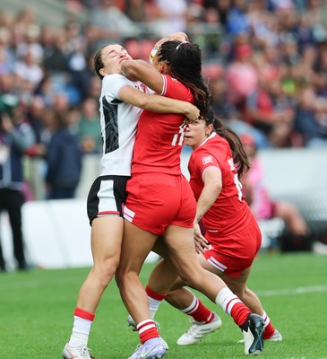 300825 - Canada v Wales, Women’s Rugby World Cup - Jasmine Joyce-Butchers of Wales and Asia Hogan-Rochester of Canada compete for the ball