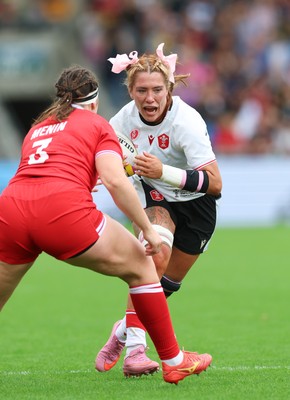 300825 - Canada v Wales, Women’s Rugby World Cup - Georgia Evans of Wales takes on DaLeaka Menin of Canada