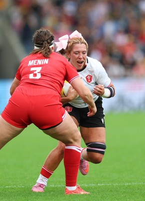 300825 - Canada v Wales, Women’s Rugby World Cup - Georgia Evans of Wales takes on DaLeaka Menin of Canada