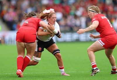 300825 - Canada v Wales, Women’s Rugby World Cup - Georgia Evans of Wales takes on DaLeaka Menin of Canada