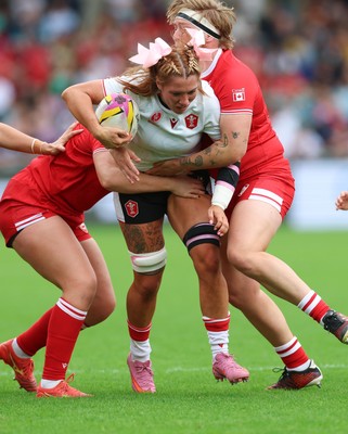 300825 - Canada v Wales, Women’s Rugby World Cup - Georgia Evans of Wales takes on DaLeaka Menin of Canada