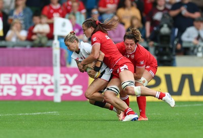 300825 - Canada v Wales, Women’s Rugby World Cup - Keira Bevan of Wales is tackled