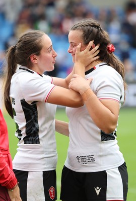 300825 - Canada v Wales, Women’s Rugby World Cup - Nel Metcalfe of Wales congratulates sister Branwen Metcalfe of Wales on her first cap at the end of the match