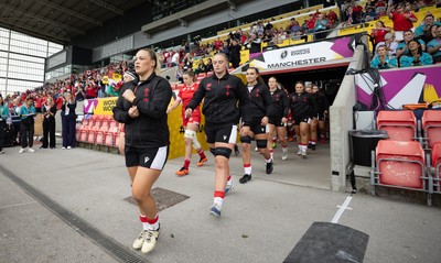 300825 - Canada v Wales, Women’s Rugby World Cup - Kelsey Jones of Wales and Tilly Vucaj of Wales walk out at the start of the match
