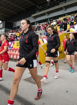 300825 - Canada v Wales, Women’s Rugby World Cup - Nel Metcalfe of Wales and Branwen Metcalfe of Wales walk out at the start of the match