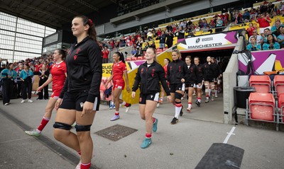 300825 - Canada v Wales, Women’s Rugby World Cup - Branwen Metcalfe of Wale and Seren Lockwood of Wales walk out at the start of the match