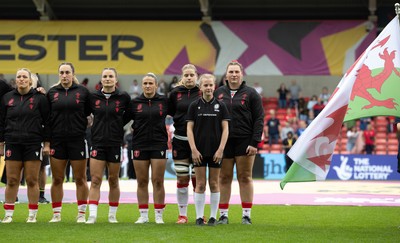 300825 - Canada v Wales, Women’s Rugby World Cup - right to left, Gwenllian Pyrs, Bethan Lewis, Kayleigh Powell, Jasmine Joyce-Butchers, Courtney Keight and Kelsey Jones of Wales line up for the anthems