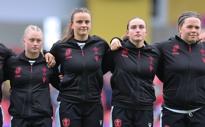 300825 - Canada v Wales, Women’s Rugby World Cup - Left to right,  Seren Lockwood, Branwen Metcalfe, Nel Metcalfe and Maisie Davies of Wales line up for the anthems
