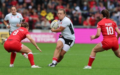 300825 - Canada v Wales, Women’s Rugby World Cup - Lleucu George of Wales takes on Justine Pelletier of Canada