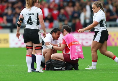 300825 - Canada v Wales, Women’s Rugby World Cup - Gwennan Williams, Wales Women team doctor treats Sisilia Tuipulotu of Wales