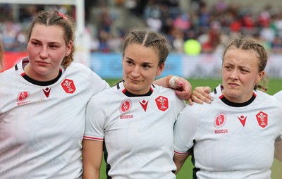 300825 - Canada v Wales, Women’s Rugby World Cup - Gwenllian Pyrs, Jasmine Joyce-Butchers and Lleucu George of Wales at the end of the match