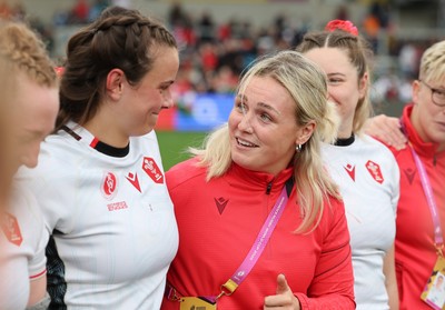 300825 - Canada v Wales, Women’s Rugby World Cup - Alex Callender of Wales speaks to Branwen Metcalfe of Wales at the end of the match