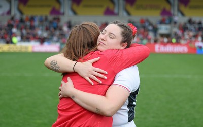 300825 - Canada v Wales, Women’s Rugby World Cup -Gwen Crabb of Wales with Kate Williams at the end of the match
