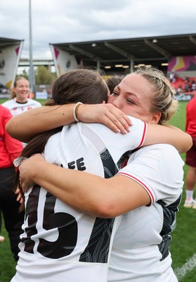 300825 - Canada v Wales, Women’s Rugby World Cup - Kelsey Jones of Wales with Nel Metcalfe of Wales at the end of the match