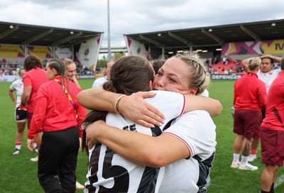 300825 - Canada v Wales, Women’s Rugby World Cup - Kelsey Jones of Wales with Nel Metcalfe of Wales at the end of the match