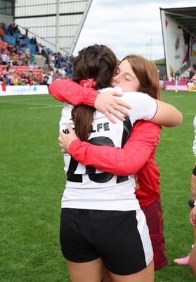 300825 - Canada v Wales, Women’s Rugby World Cup - Kate Williams of Wales with Nel Metcalfe of Wales at the end of the match