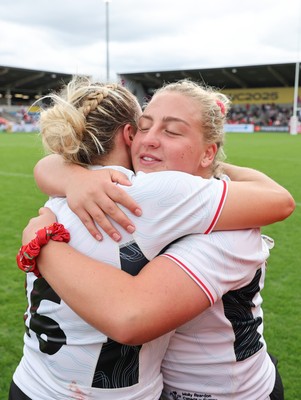 300825 - Canada v Wales, Women’s Rugby World Cup - Molly Reardon of Wales with Kelsey Jones of Wales at the end of the match