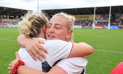 300825 - Canada v Wales, Women’s Rugby World Cup - Molly Reardon of Wales with Kelsey Jones of Wales at the end of the match