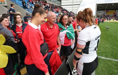 300825 - Canada v Wales, Women’s Rugby World Cup - Wales players with supporters at the end of the match