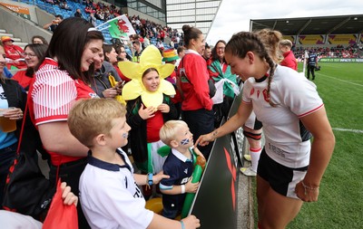 300825 - Canada v Wales, Women’s Rugby World Cup - Wales players with supporters at the end of the match