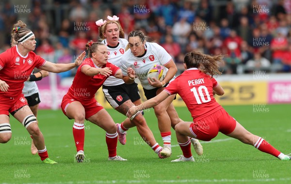 300825 - Canada v Wales, Women’s Rugby World Cup - Courtney Keight of Wales takes on Taylor Perry of Canada