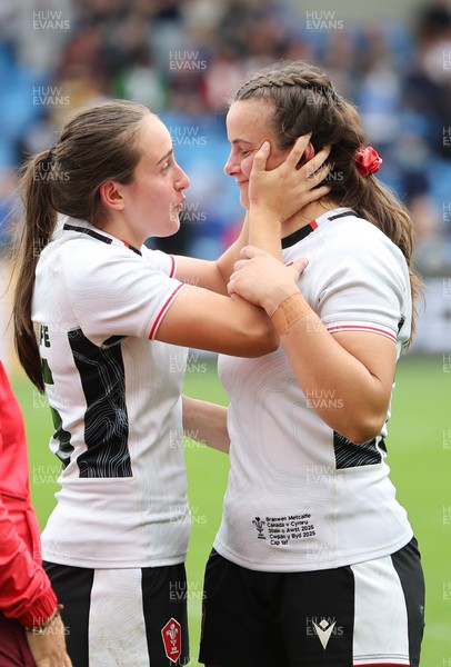 300825 - Canada v Wales, Women’s Rugby World Cup - Nel Metcalfe of Wales congratulates sister Branwen Metcalfe of Wales on her first cap at the end of the match