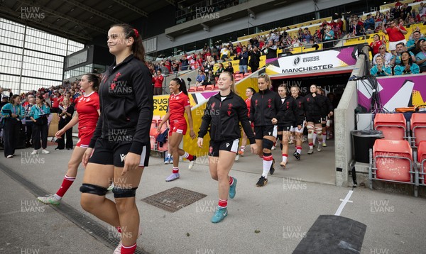 300825 - Canada v Wales, Women’s Rugby World Cup - Branwen Metcalfe of Wale and Seren Lockwood of Wales walk out at the start of the match