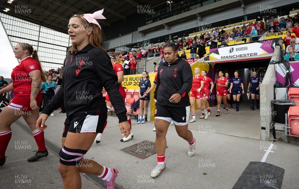 300825 - Canada v Wales, Women’s Rugby World Cup - Georgia Evans of Wales and Sisilia Tuipulotu of Wales walk out at the start of the match