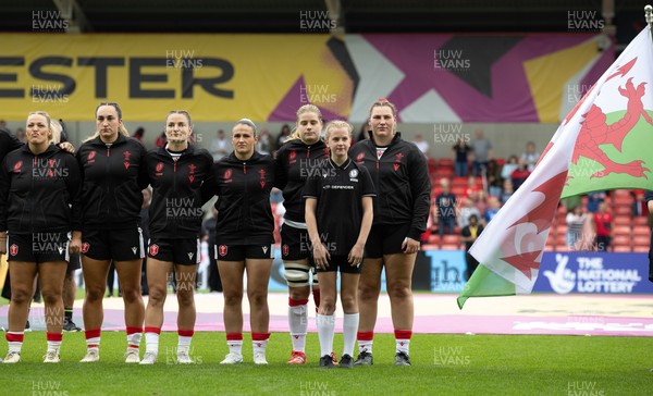 300825 - Canada v Wales, Women’s Rugby World Cup - right to left, Gwenllian Pyrs, Bethan Lewis, Kayleigh Powell, Jasmine Joyce-Butchers, Courtney Keight and Kelsey Jones of Wales line up for the anthems