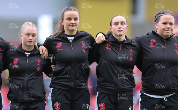 300825 - Canada v Wales, Women’s Rugby World Cup - Left to right,  Seren Lockwood, Branwen Metcalfe, Nel Metcalfe and Maisie Davies of Wales line up for the anthems