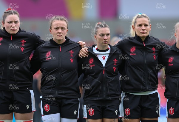 300825 - Canada v Wales, Women’s Rugby World Cup - Left to right, Gwen Crabb, Lleucu George, Keira Bevan and Kerin Lake of Wales line up for the anthems