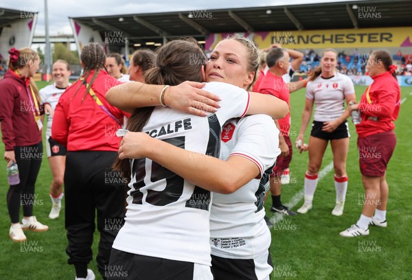 300825 - Canada v Wales, Women’s Rugby World Cup - Kelsey Jones of Wales with Nel Metcalfe of Wales at the end of the match