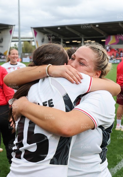 300825 - Canada v Wales, Women’s Rugby World Cup - Kelsey Jones of Wales with Nel Metcalfe of Wales at the end of the match