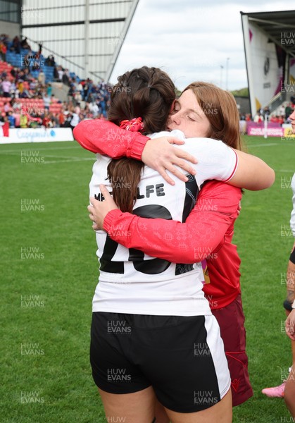 300825 - Canada v Wales, Women’s Rugby World Cup - Kate Williams of Wales with Nel Metcalfe of Wales at the end of the match