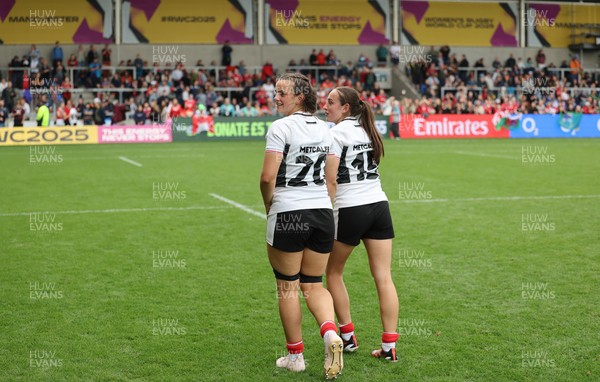300825 - Canada v Wales, Women’s Rugby World Cup - Sisters Branwen Metcalfe of Wales and Nel Metcalfe of Wales at the end of the match