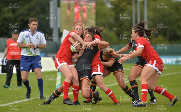 130817 - Canada v Wales - Women's Rugby World Cup - Jess Kavanagh-Williams of Wales in action against Alex Tessier, left, of Canada
