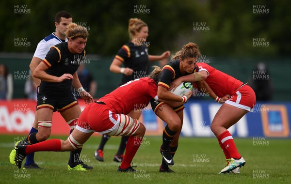 130817 - Canada v Wales - Women's Rugby World Cup - Jess Kavanagh-Williams of Wales is tackled by Kelly Russell of Canada, left,