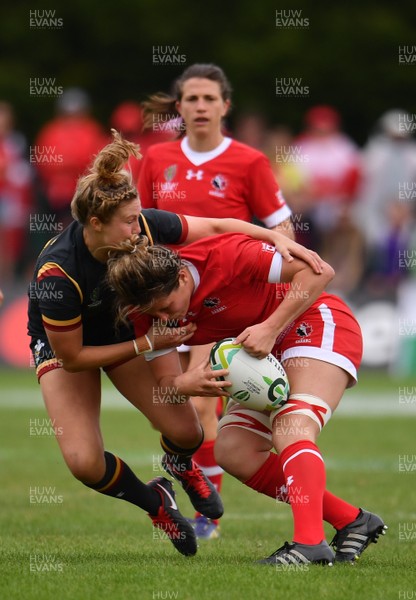 130817 - Canada v Wales - Women's Rugby World Cup - Kelly Russell of Canada is tackled by Dyddgu Hywel of Wales