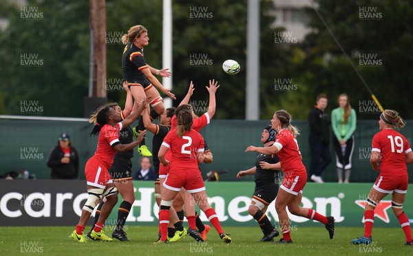 130817 - Canada v Wales - Women's Rugby World Cup - Rachel Taylor of Wales is lifted in a lineout